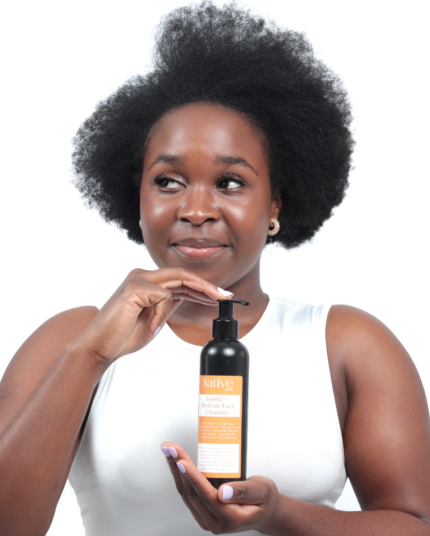 Model posing with Soothe + Hydrate Face Cleanser