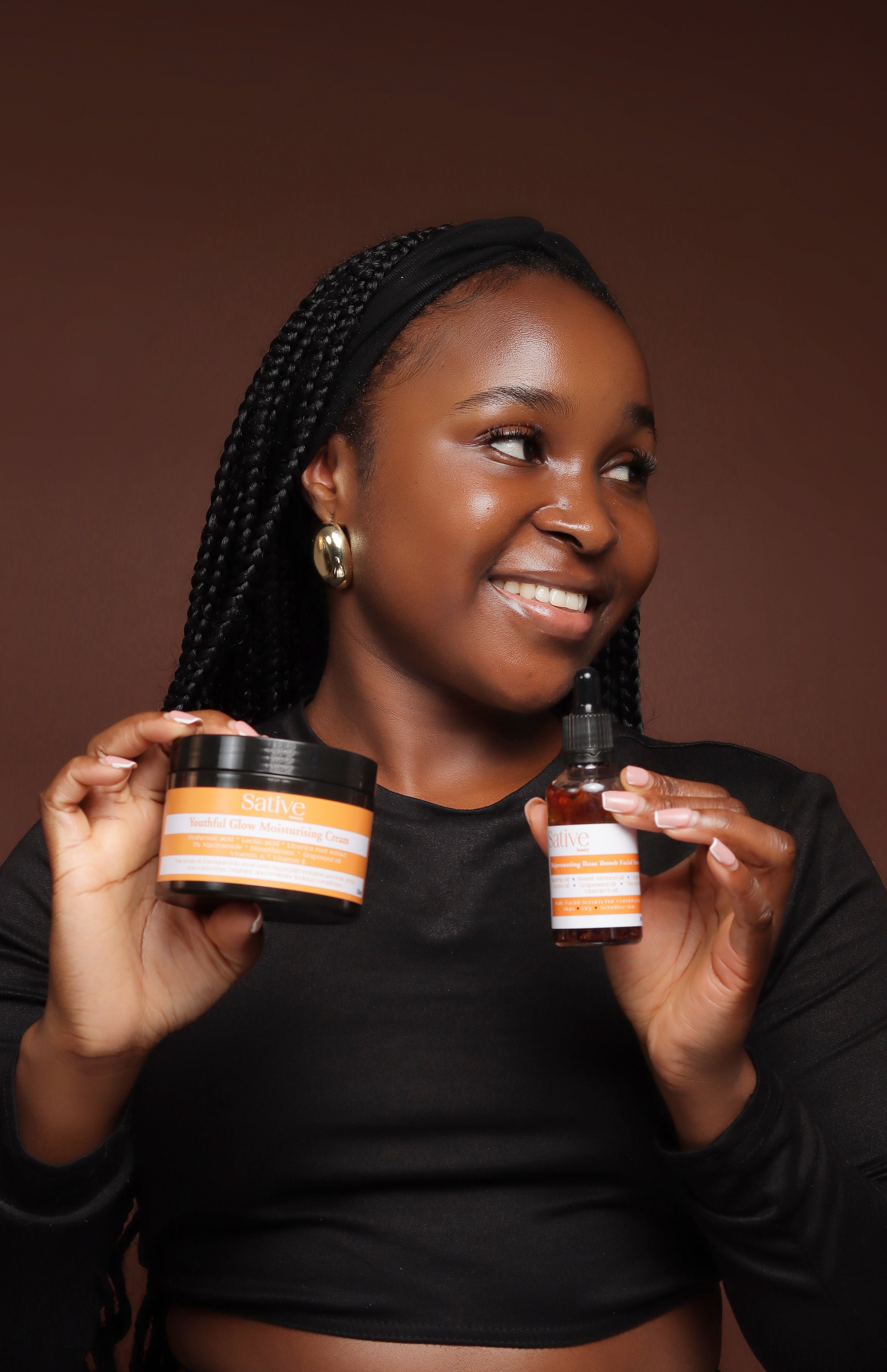 female model posing with skincare product