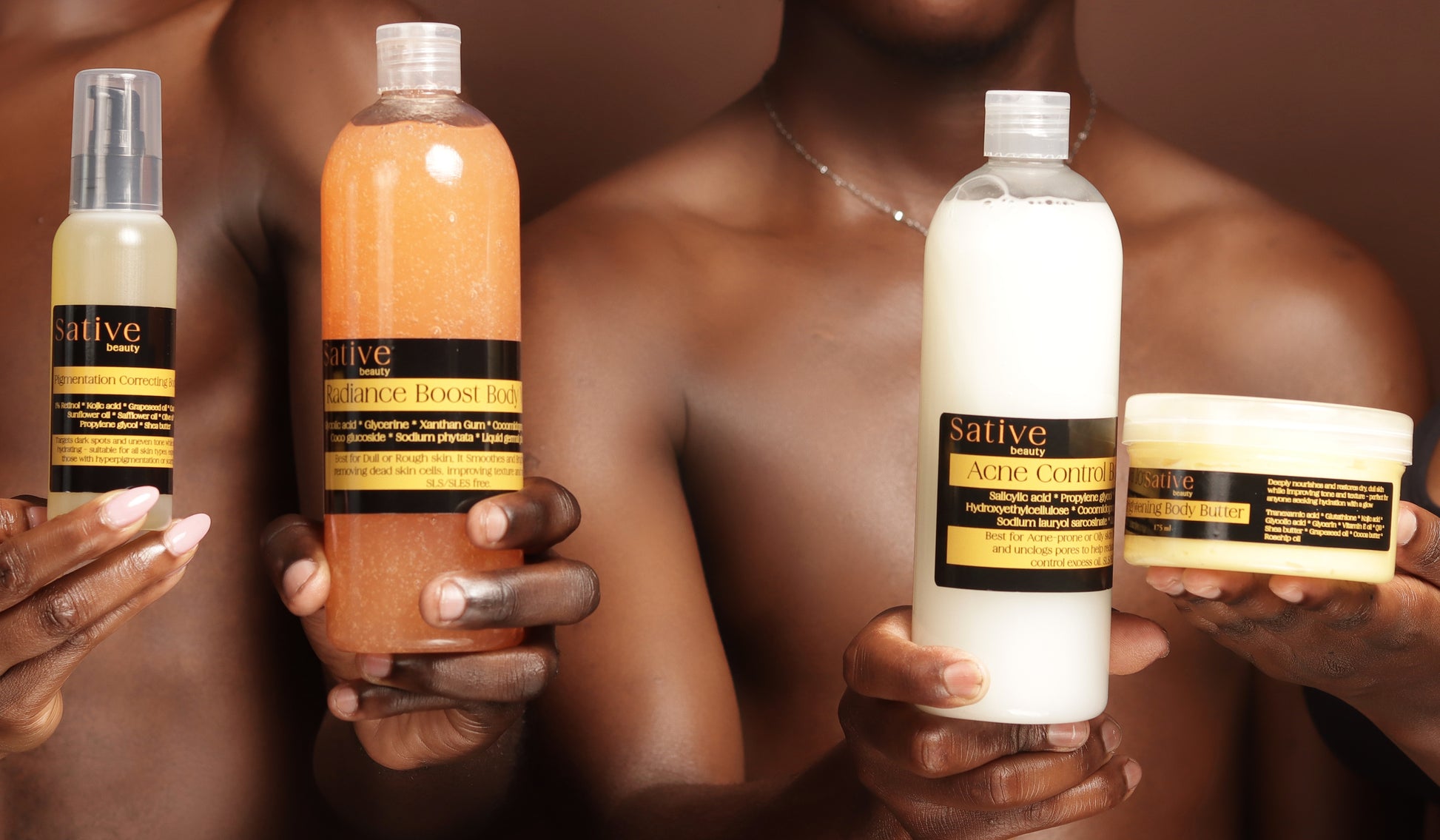 Collection of Sative skincare products held by a person against a brown background