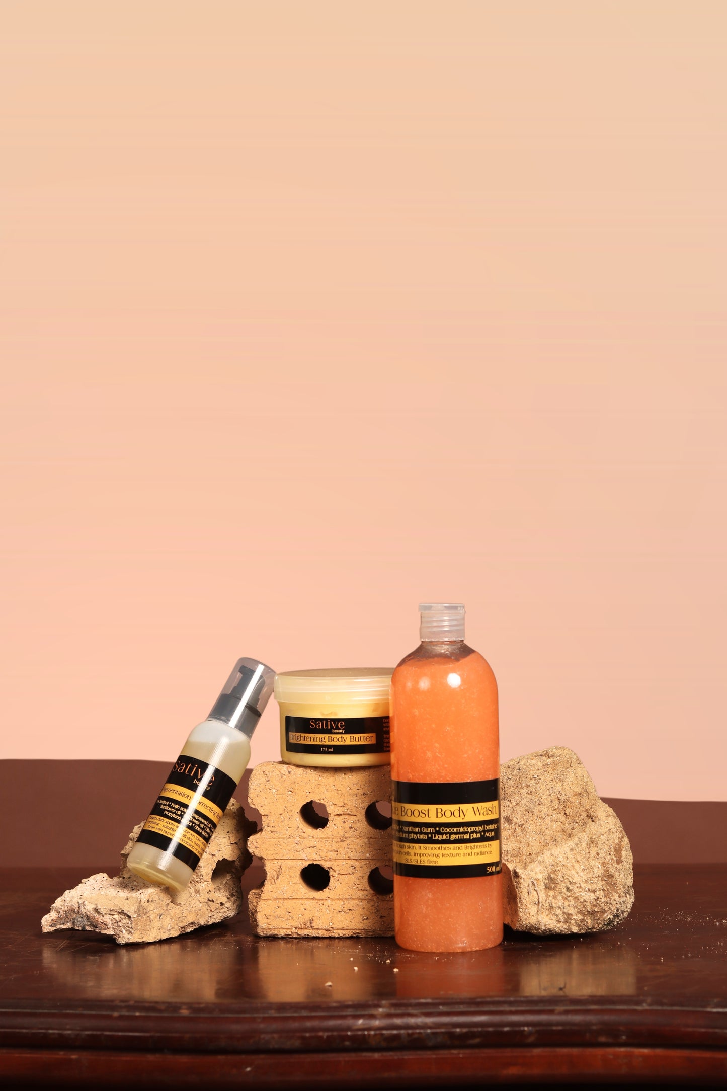 Three skincare products on a wooden surface with a beige background