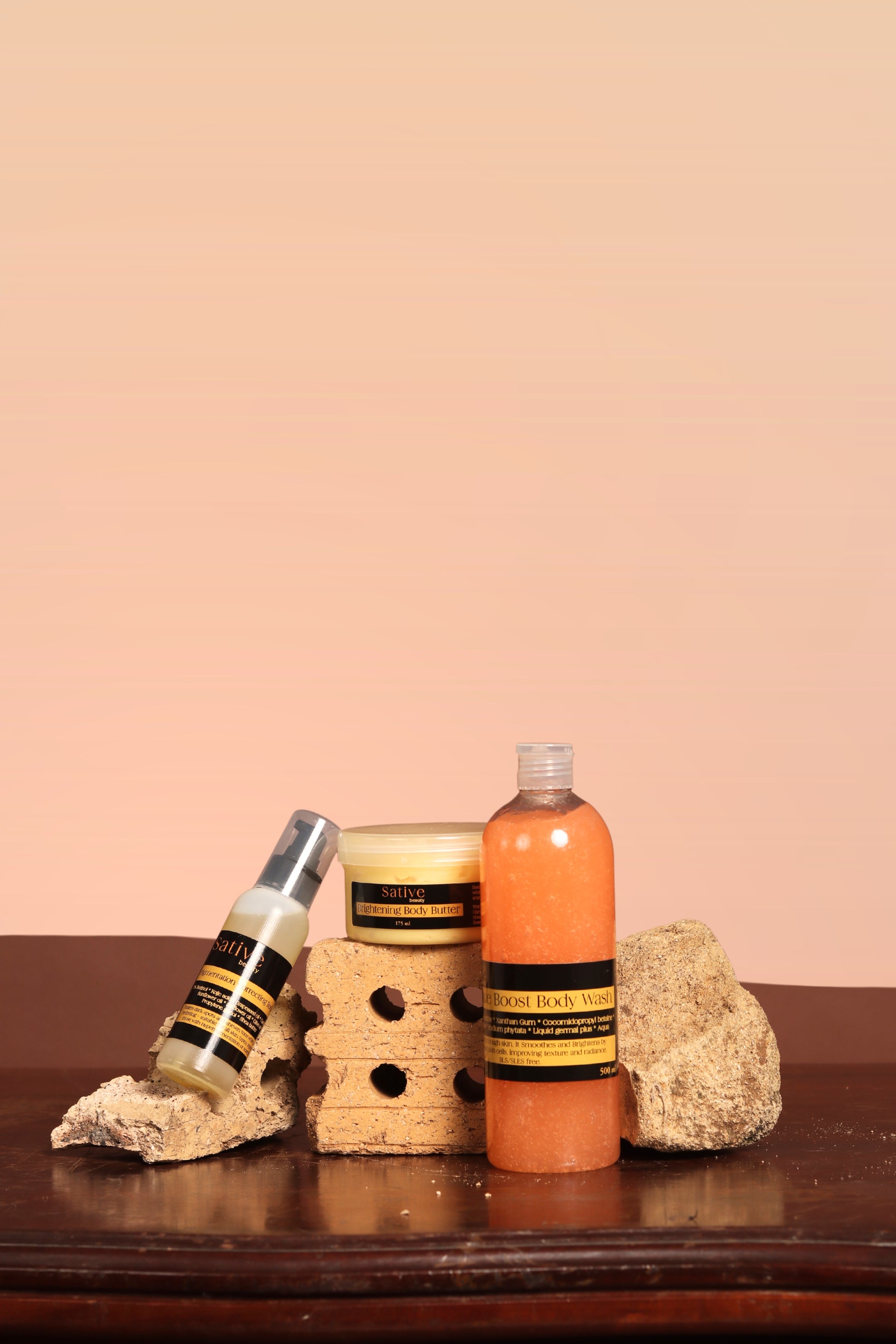 Three skincare products on a wooden surface with a beige background