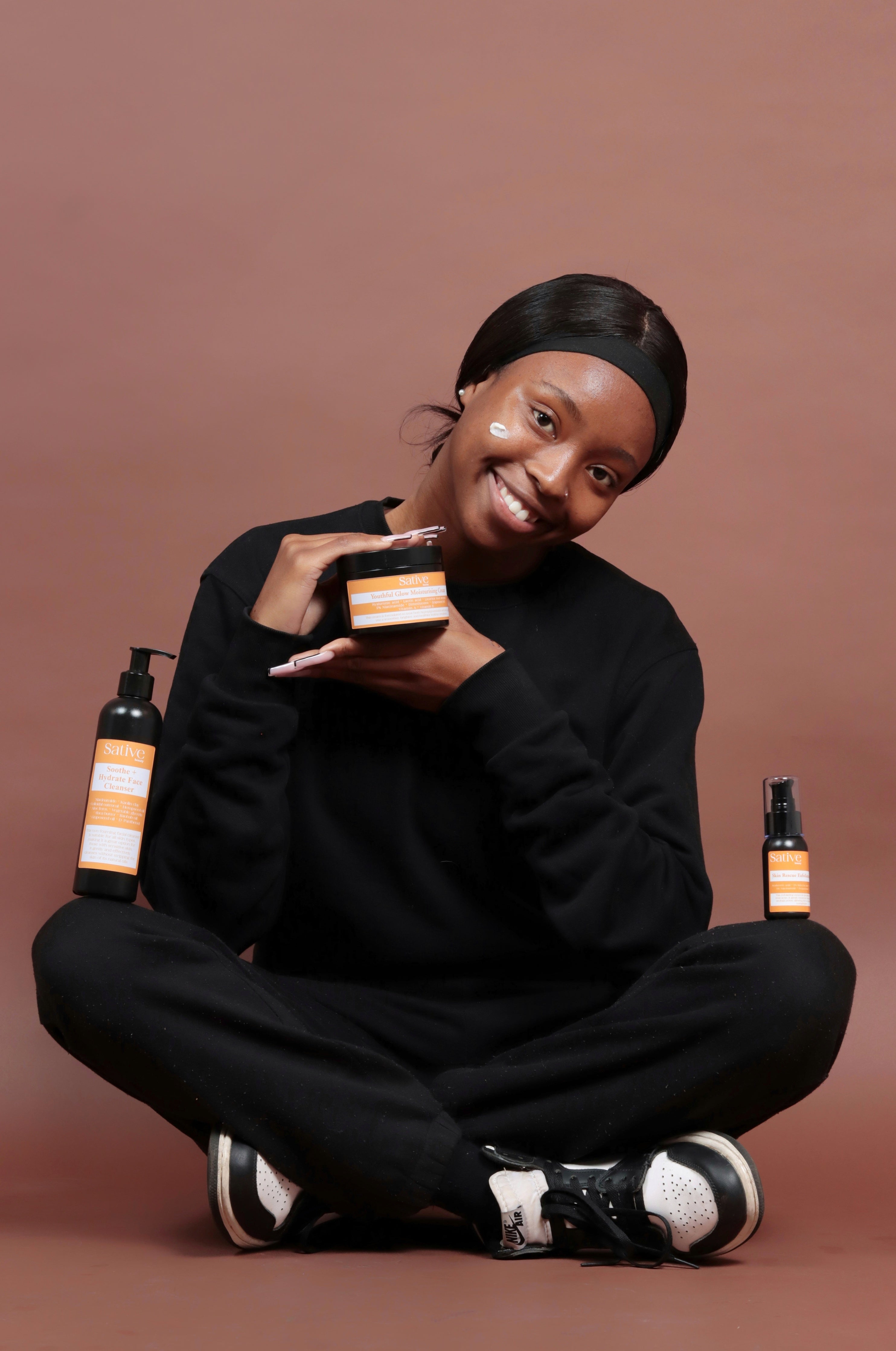 model posing with the Acne Control Product range