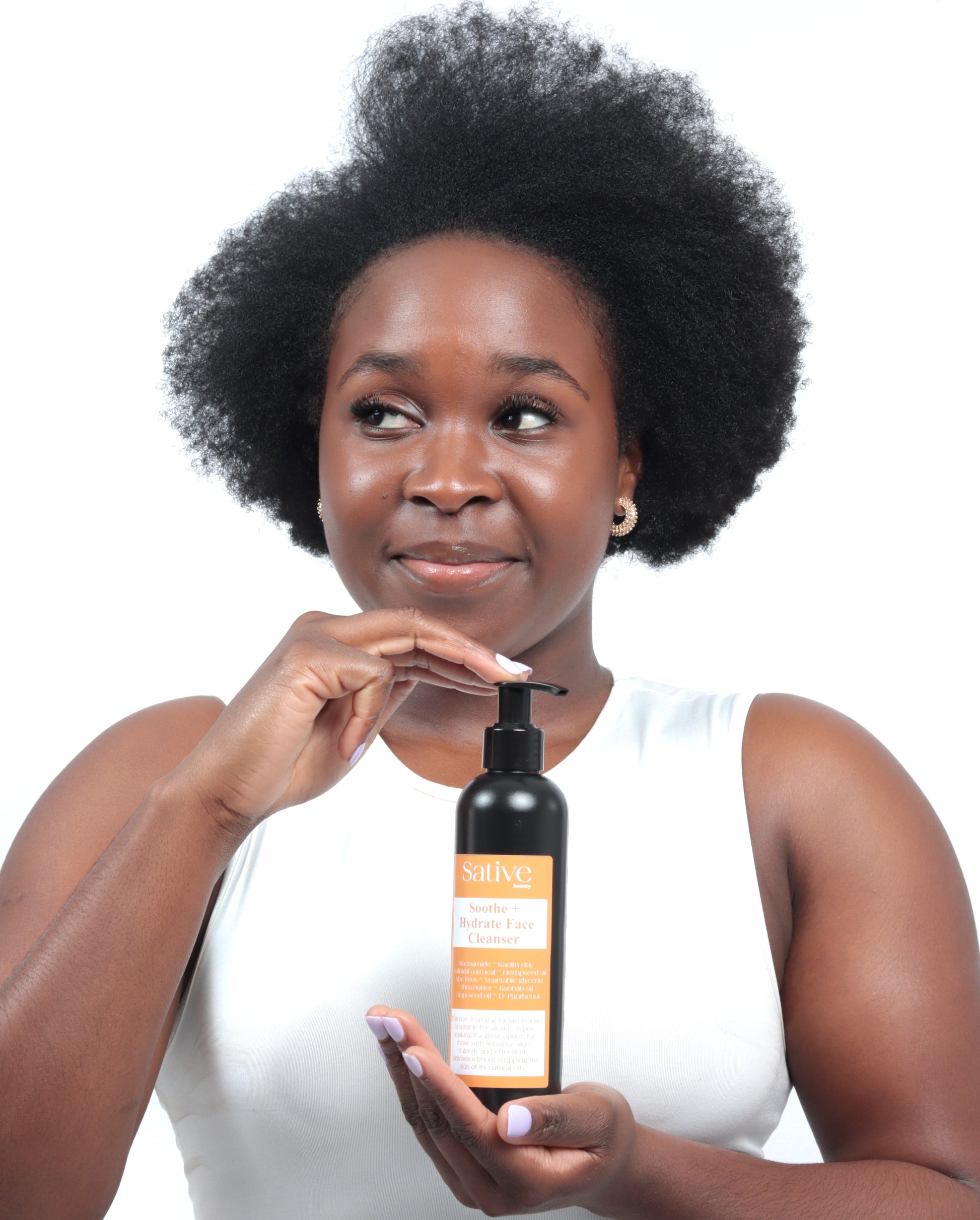Model posing with Soothe + Hydrate Face Cleanser