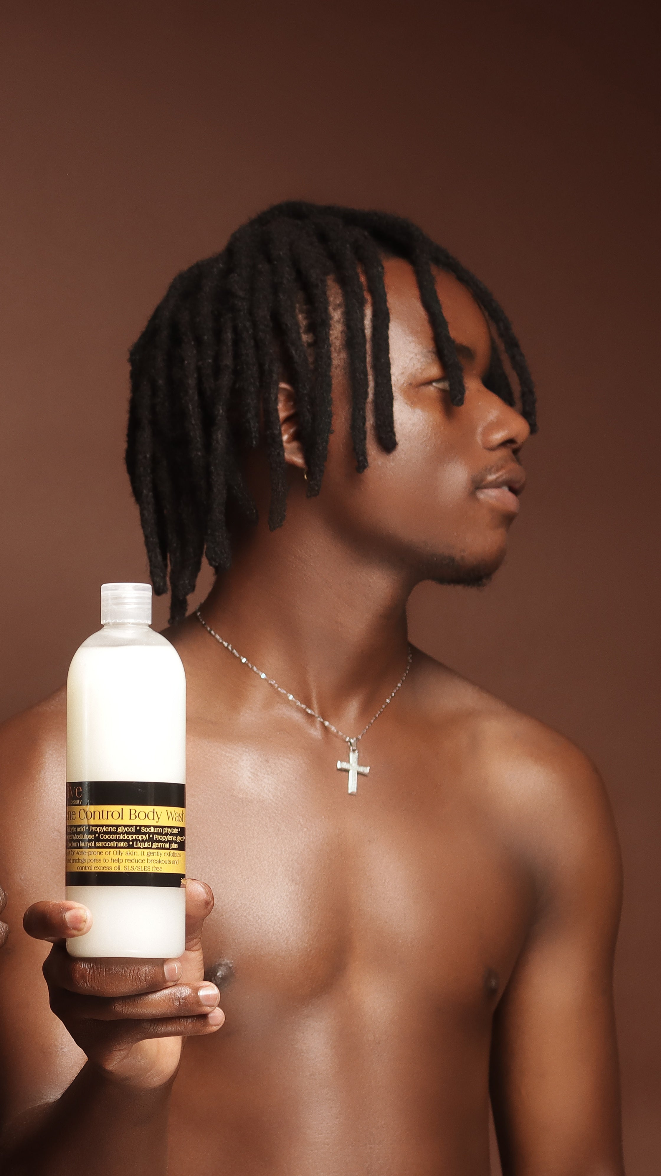 a man holding the Acne Control Body wash  