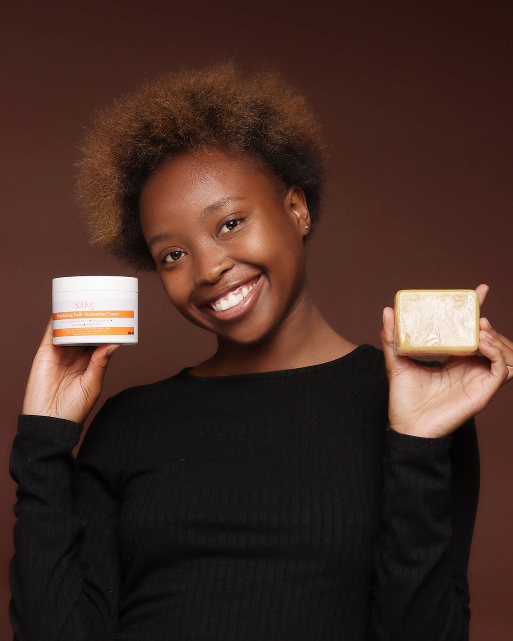 female model posing with skincare product