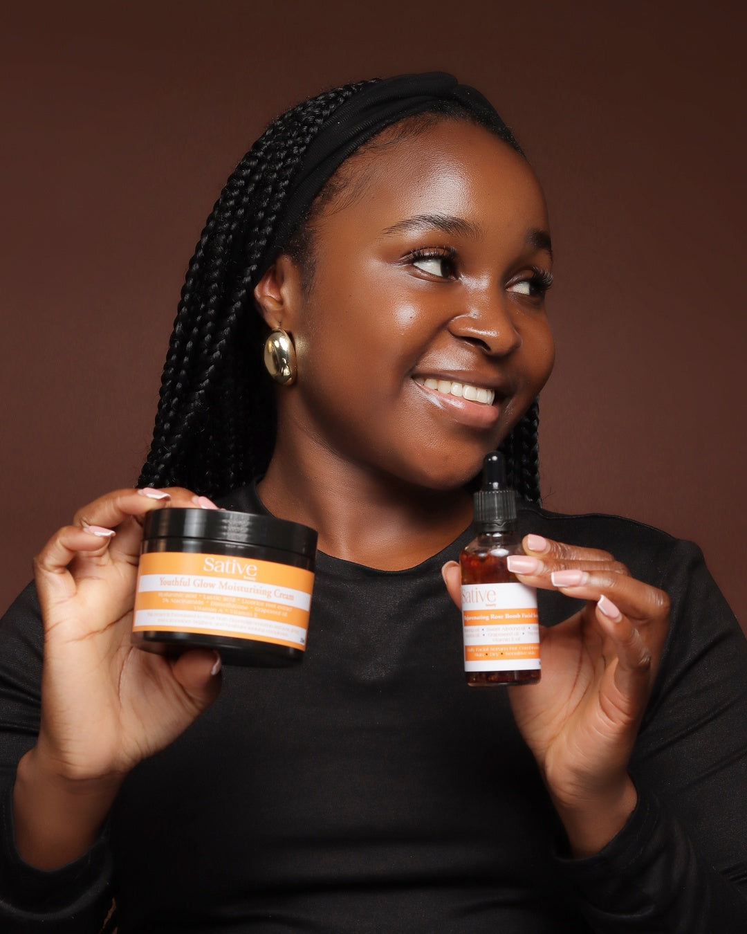female model posing with skincare product